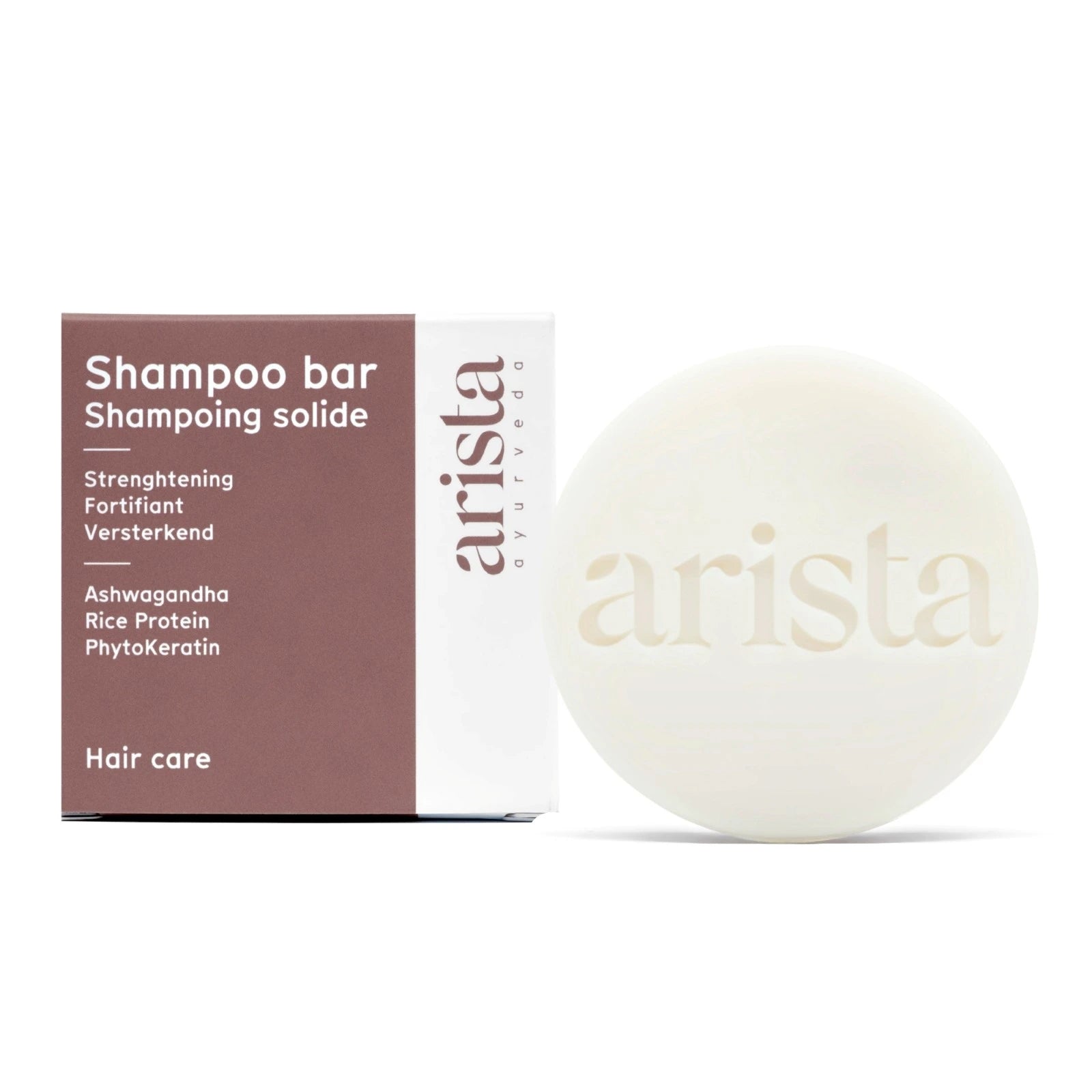 Arista strengthening shampoo bar and packaging on a white background