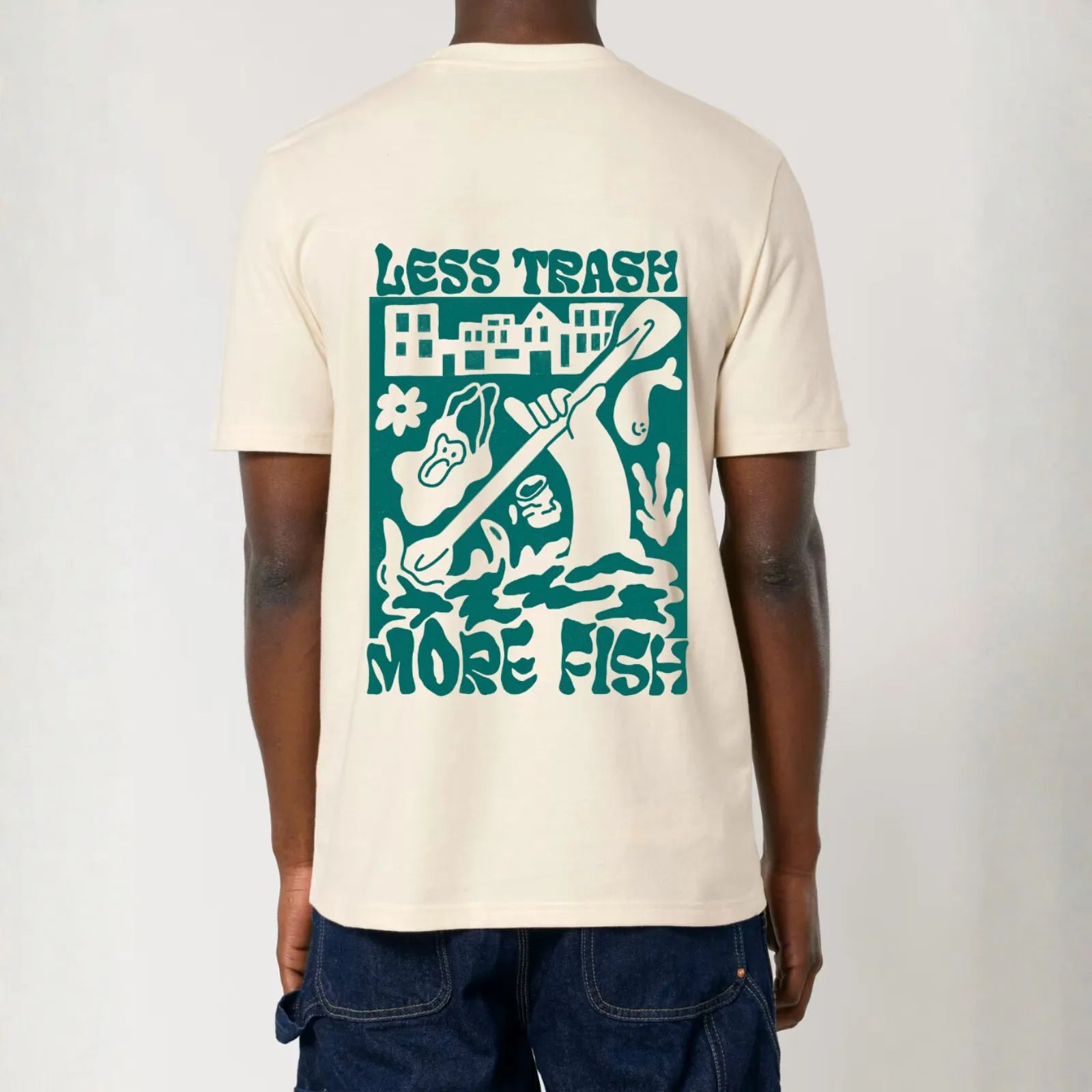 A man wearing unisex City to Ocean T-shirt with &#39;Less Trash More Fish&#39; graphic design on the back. 100% Cotton in natural raw white, untreated sustainable fabric