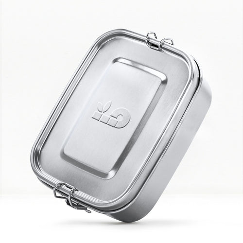 Metallic rectangular bambaw lunch box container with a lid on a white background